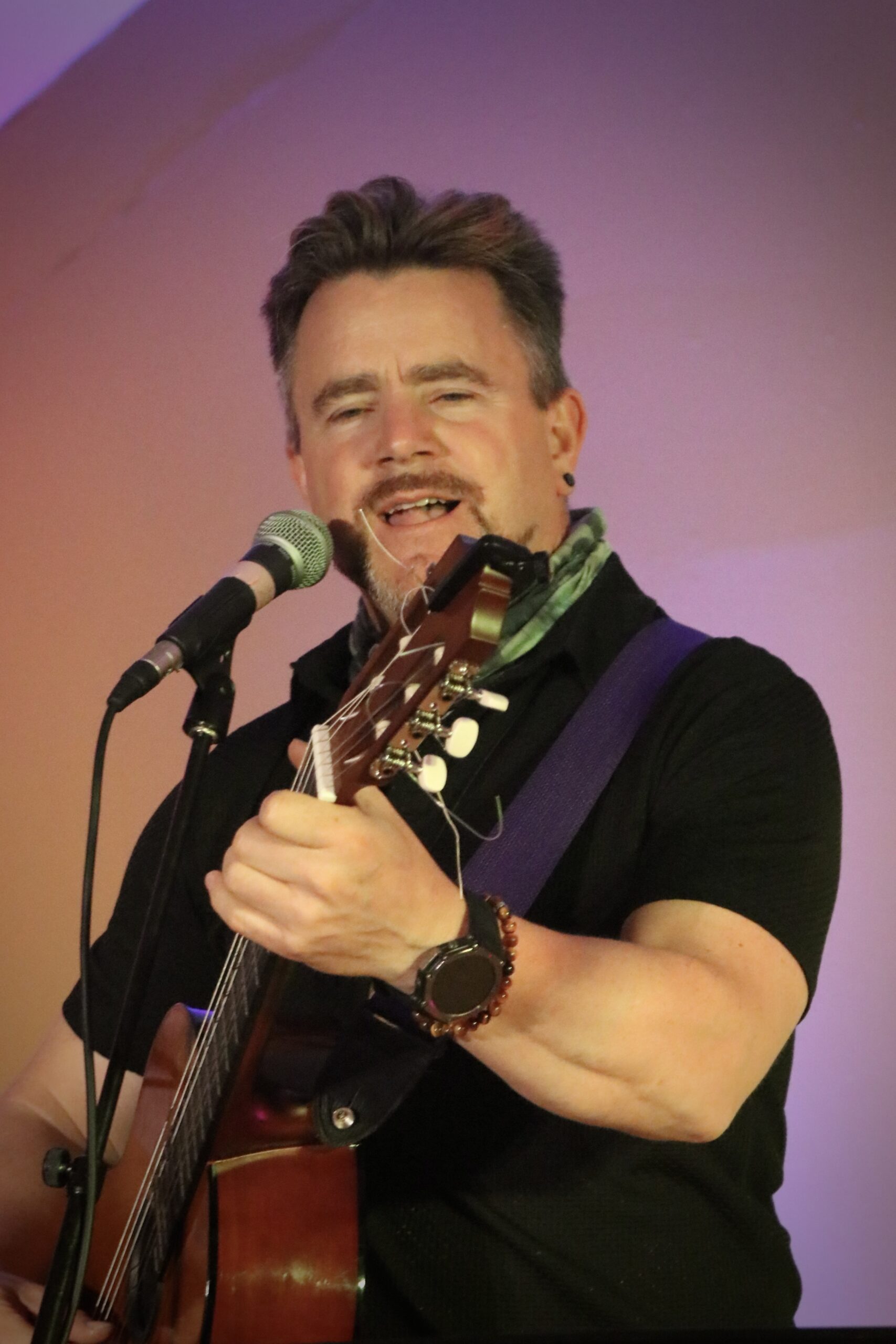 Douglas Hudson sings and plays guitar at BayFest